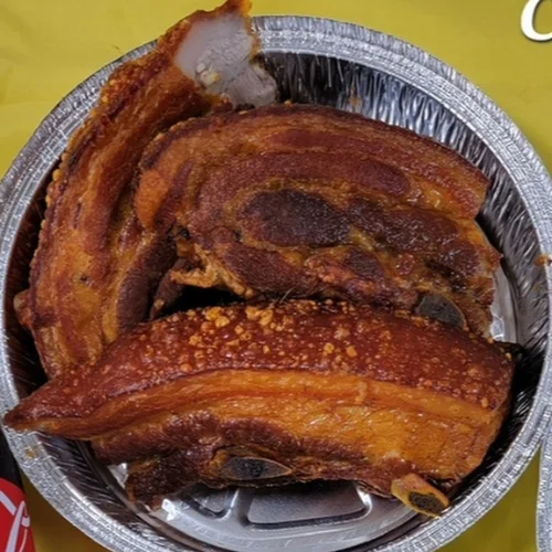 Chicharrón de Cerdo - Crispy, golden fried pork belly — perfectly seasoned and absolutely irresistible.